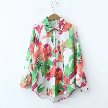 Floral blouse on a hanger against a white background