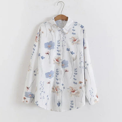 Floral-patterned shirt on a hanger against a white background