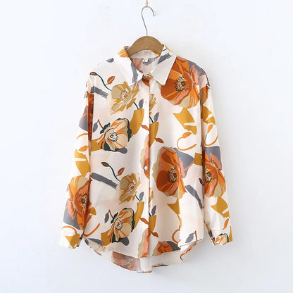 Floral patterned shirt on a hanger against a white background