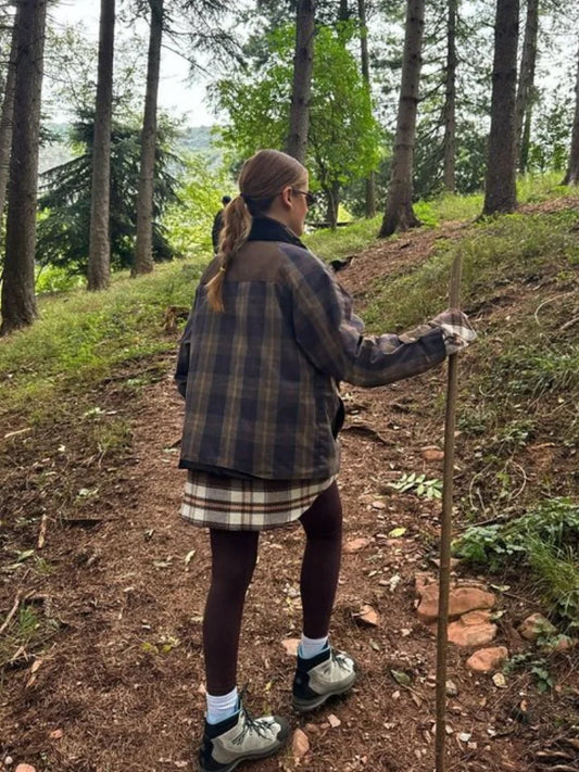 Person hiking on a trail in a forest