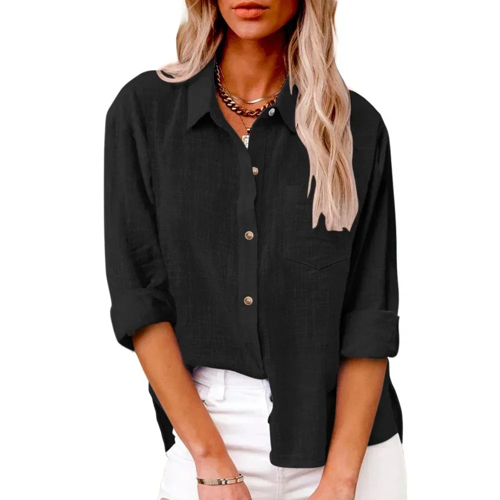 Person wearing a black button-up shirt with rolled-up sleeves on a white background
