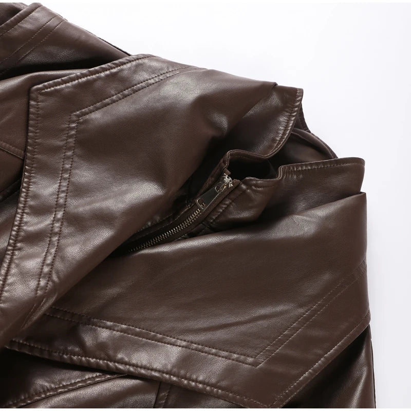 Close-up of a brown leather jacket with a zipper on a white background