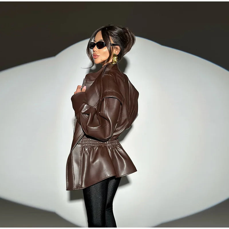 Woman wearing a brown leather jacket on a white background