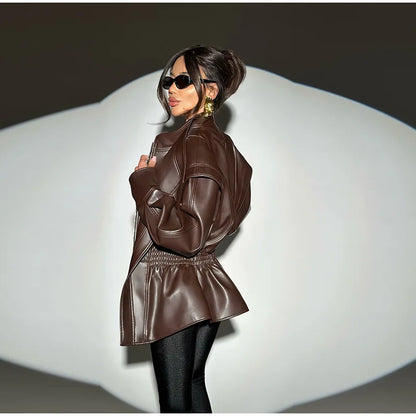 Woman wearing a brown leather jacket on a white background