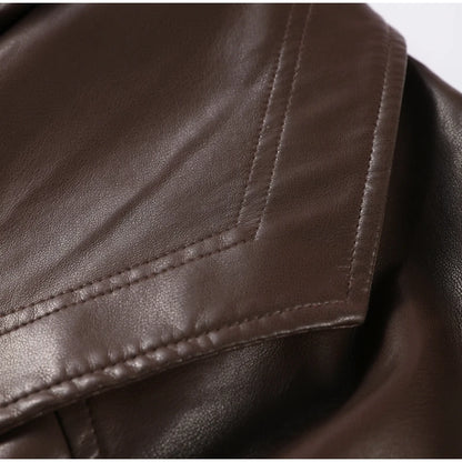Close-up of brown leather fabric with stitching detail