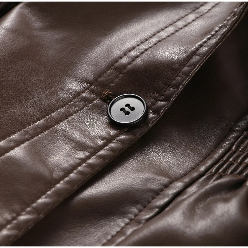 Close-up of a brown leather jacket with a button