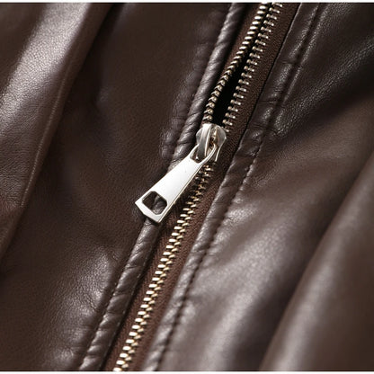 Close-up of a brown leather jacket with a silver zipper
