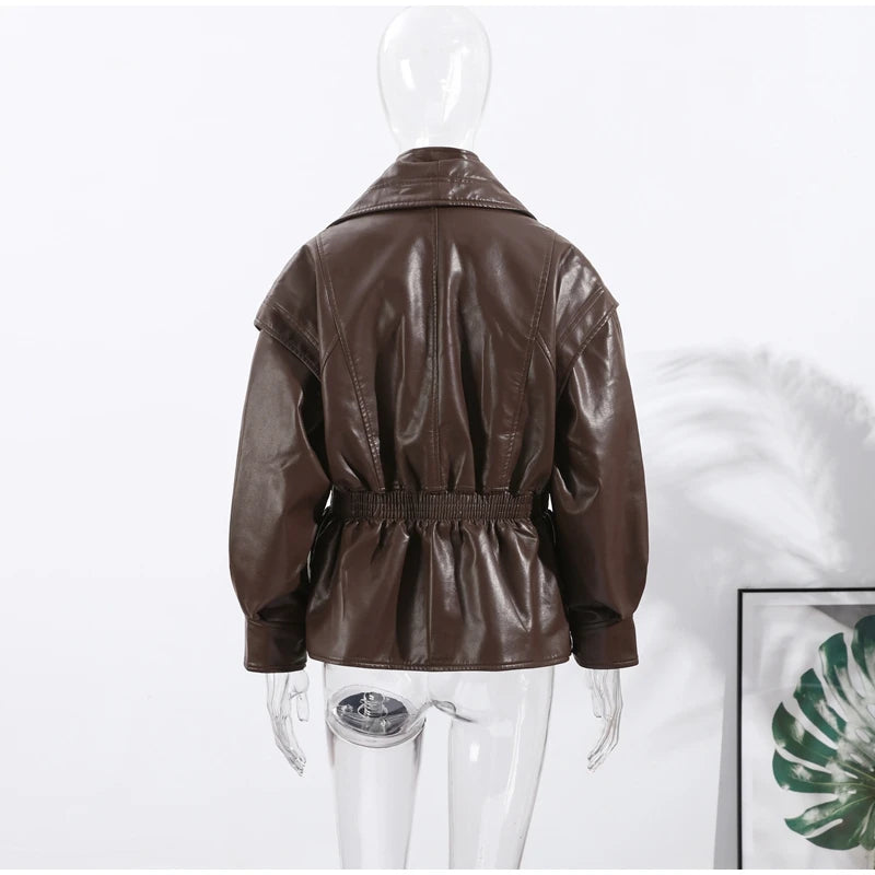 Brown leather jacket on a mannequin against a white background