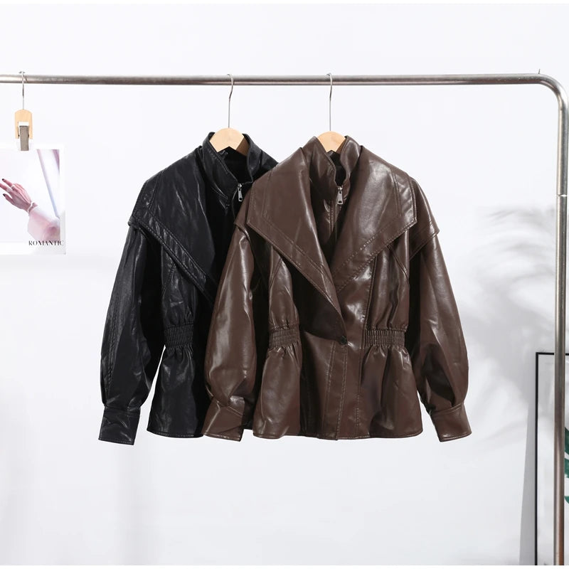 Two leather jackets, one black and one brown, hanging on a rack against a white background.