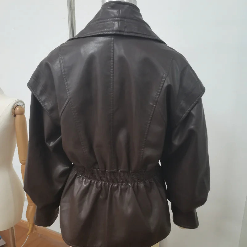 Black leather jacket on a mannequin against a white background
