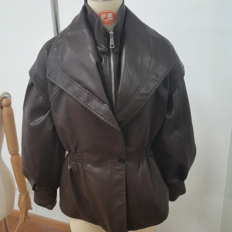 Brown leather jacket on a mannequin against a white background