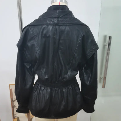 Black leather jacket on a mannequin against a white background