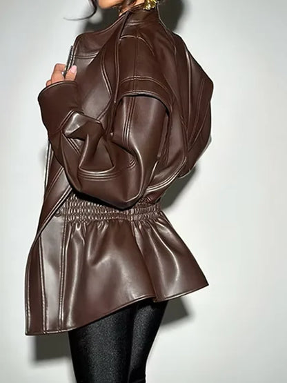 Brown leather jacket worn by a person on a white background
