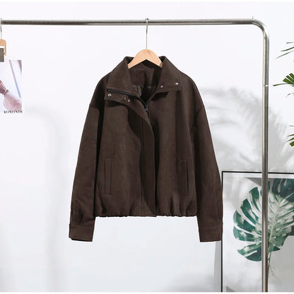 Brown jacket hanging on a rack against a white background