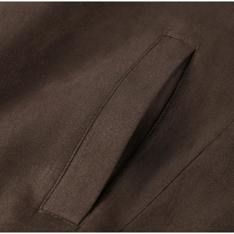 Close-up of a brown fabric with a pocket detail