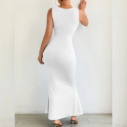 Woman wearing a white sleeveless dress against a plain background