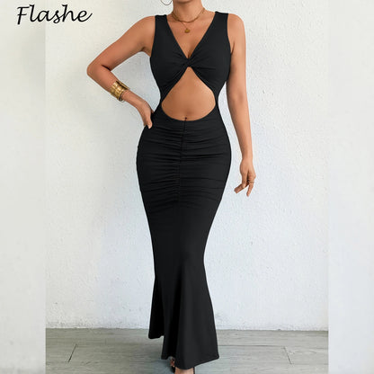 Black dress with cut-out design worn by a person against a white wall, brand 'Flashe' visible.