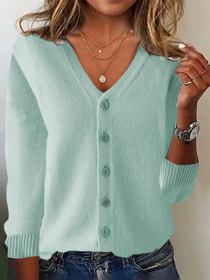 Light blue cardigan worn by a person with a neutral background