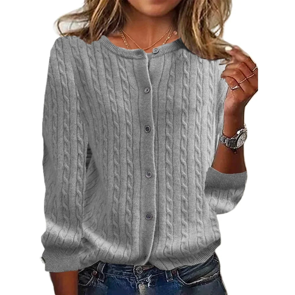 Gray cable knit cardigan worn by a person on a white background
