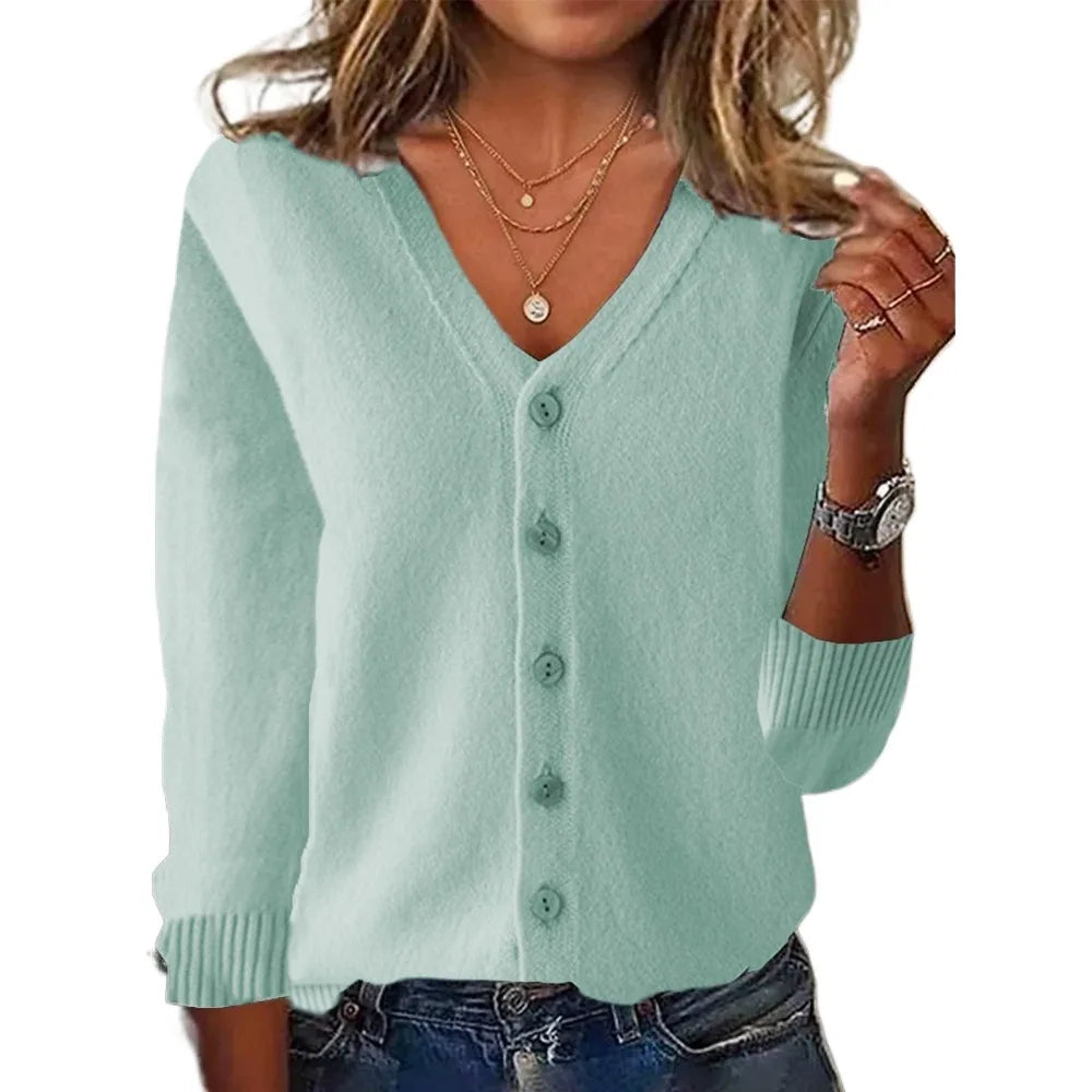 Light blue cardigan worn by a person on a white background
