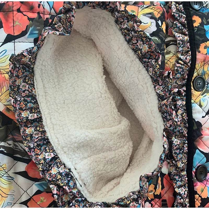 Close-up of a white fleece-lined hood on a colorful floral-patterned jacket.