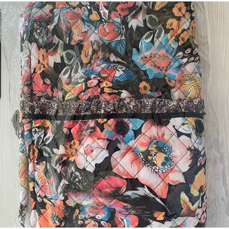 Floral-patterned backpack on a light wooden surface