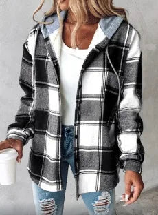 Person wearing a black and white plaid hoodie with a white shirt underneath.