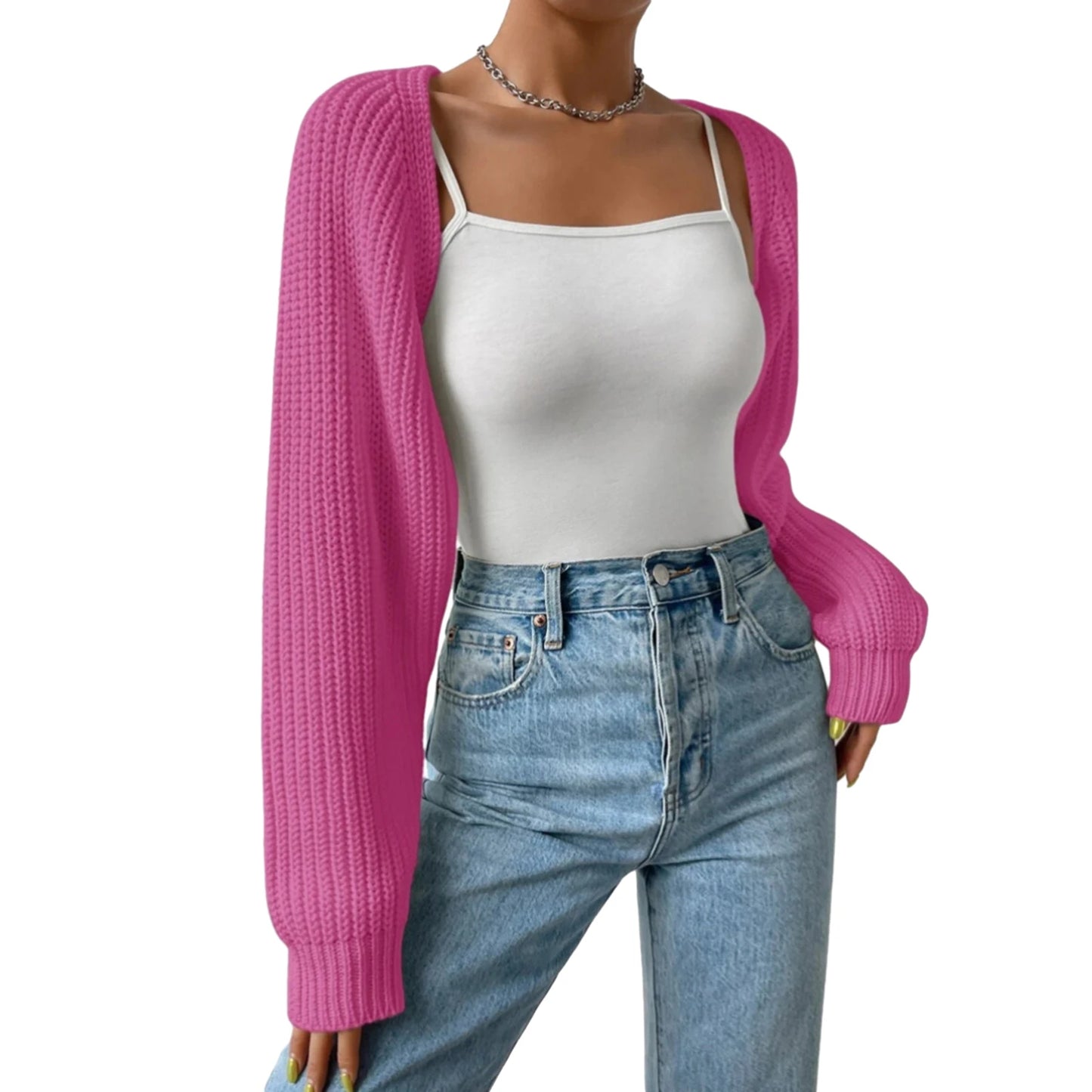 Person wearing a pink cardigan, white tank top, and blue jeans on a white background