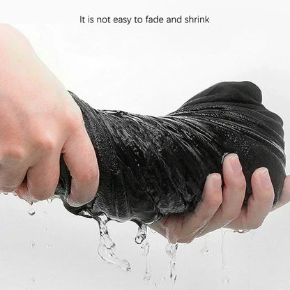 Person holding a black towel with water dripping off, text 'It is not easy to fade and shrink' above.